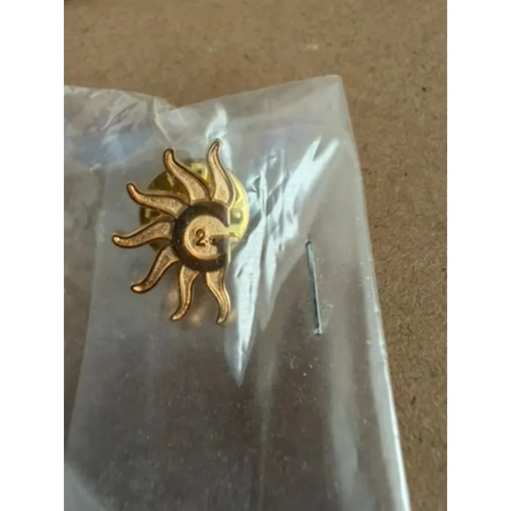 Gold metal sunburst design Pin with G2 lapel pin